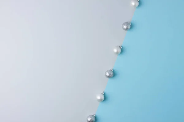 Christmas grey and blue minimal background with grey ball. Flat lay, copy space