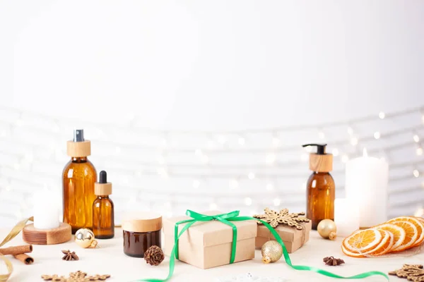 Christmas cosmetic product display on white background. Close up, copy space