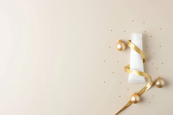 Christmas Tree Shape Made Cosmetic Cream Tube Gold Ribbon Balls — Stock Photo, Image