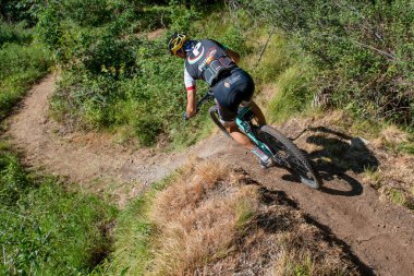 Rovetta Italy 31 July 2022: Cyclists traveling on challenging trails on mountain bikes