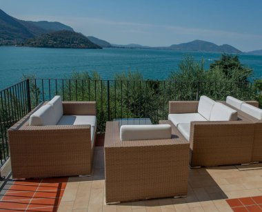 Terrace with armchairs overlooking the lake