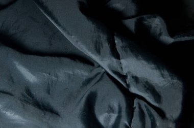 Siyah bir ceketin dokusu.