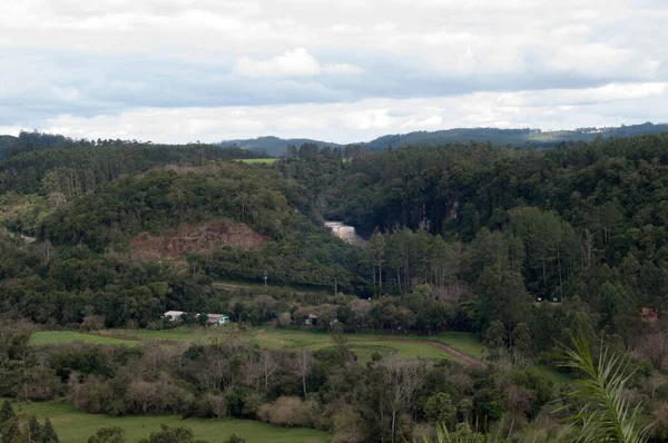 Aerial landscape photograph with a waterfall among the trees