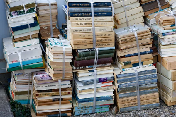 Stacks of old books bundled for recycling — Stock Photo, Image