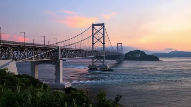 Timelapse Strong Current Flowing Suspension Bridge Sunset High Quality Footage — Stockvideo