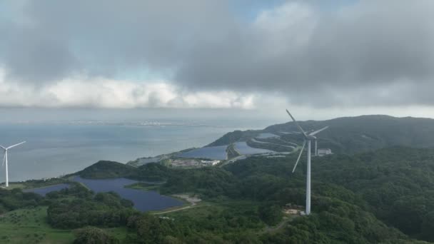 Aerial Pullback Clouds Moving Wind Turbines Coastal Energy Farm High — Stock Video