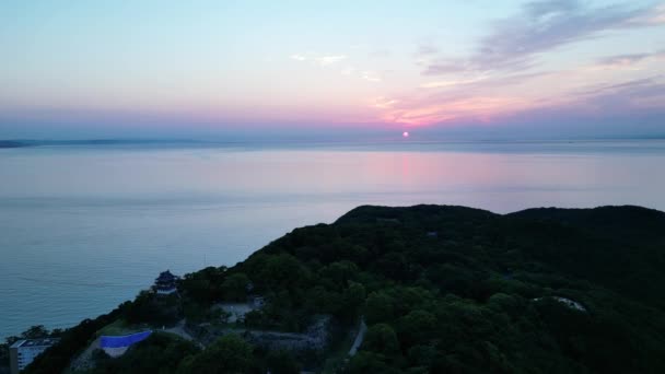 Slow Aerial Pullback Sumuto Castle Overlooking Ocean Sunrise High Quality — Stock video
