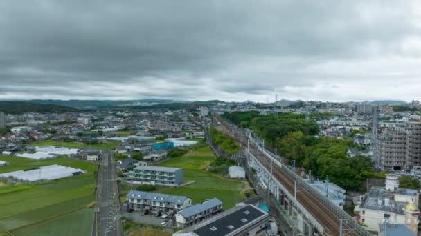 Aerial Timelapse Rise Shinkansen Tracks Trains Pass Cloudy Day High — ストック動画