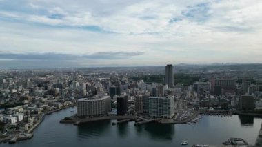 Flying over water leaving downtown Akashi in early morning. High quality 4k footage