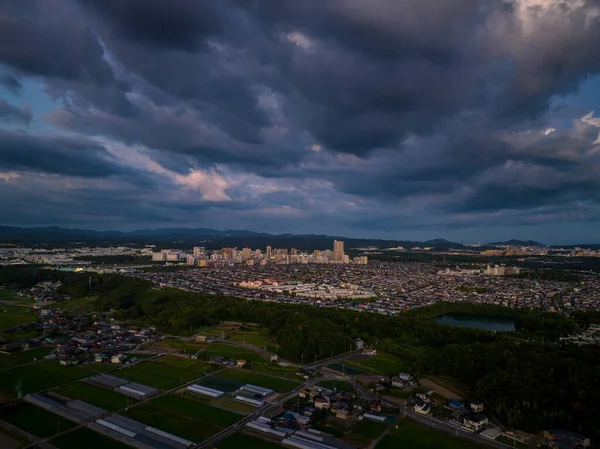 Dramatic clouds over small suburban development at dusk. High quality photo