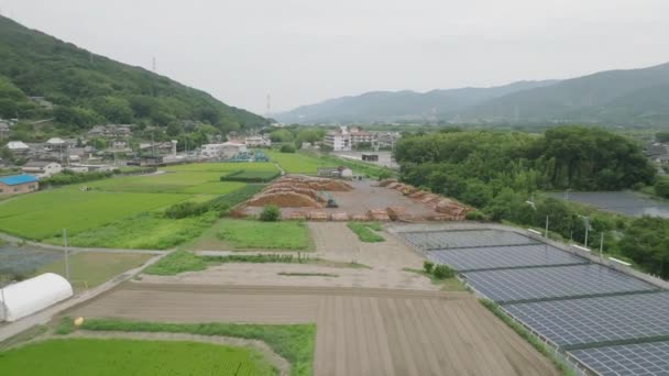 Flyby Solar Panels Stacks Logs Next Fields Countryside High Quality — Video Stock