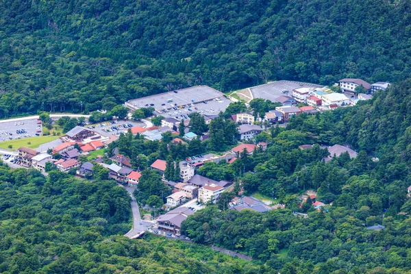 Aerial view of small mountain resort town and empty parking lots in off season. High quality photo
