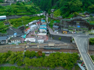 Aerial view of outdoor train station in small mountain village. High quality photo