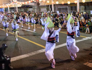 Tokushima, Japan - August 12, 2022: Performers dance down street at Awaodori festival. High quality photo