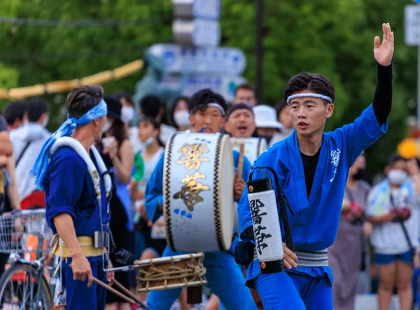 Tokushima, Japan - August 12, 2002: Male performer raises arm at Awaodori street festival. High quality photo