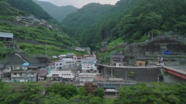 Aerial view of Oboke Station along the Yoshino River in green mountains. High quality 4k footage