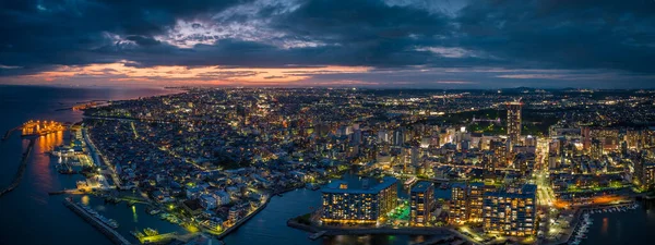 Panoramic aerial view of Akashi City as night falls with dramatic sunset. High quality photo