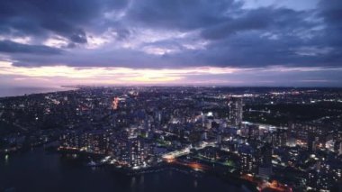 Sunset afterglow over coastal city in blue hour. High quality 4k footage