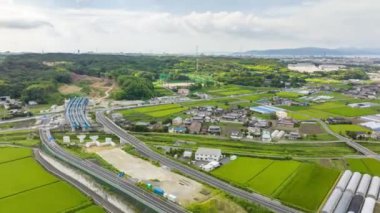 Hyperlapse: Light traffic moves by uncompleted highway overpass in rural area. High quality 4k footage