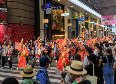 Kochi, Japan - August 10, 2022: Energetic dancers in shopping arcade during summer Yosakoi Festival. High quality photo