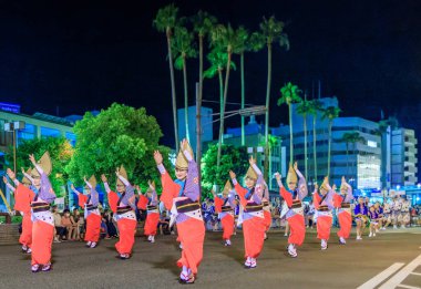 Tokushima, Japan - August 12, 2022: Traditional Awaodori dance performed by women in traditional hats and kimonos. High quality photo