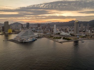 Quiet waterfront along Merikan Park and downtown Kobe City at sunset. High quality photo