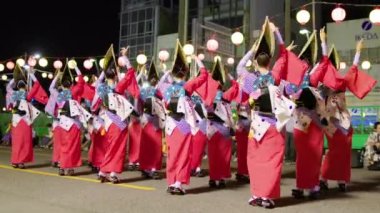 Tokushima, Japan - August 12, 2022: Dancers perform at traditional Japanese street festival at night. High quality 4k footage
