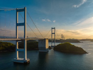 Side view of Kurushima bridge leading to Imabari as sun sets. High quality photo