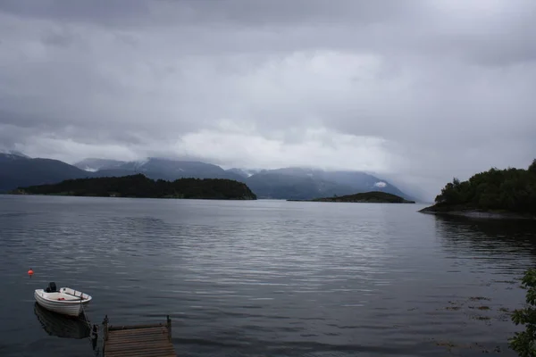 Oystese, cabins on the shores of the fjord. Norway.