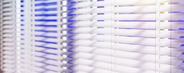 Panoramic view of White Venetian blinds with sunlight. Window blinds. 3d rendering.