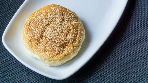 The homemade bread rolls with sesame seeds. Burger buns with sesame seeds, ingredients for hamburger.