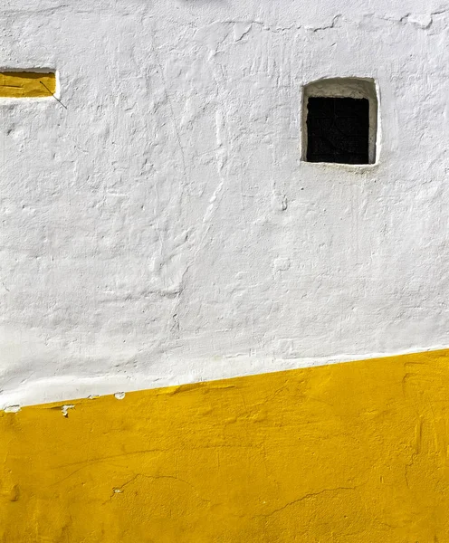 White and orange facade in the famous Candelaria, Bogota, Colombia. This minimalist picture makes a nice abstraction or  a backdrop.