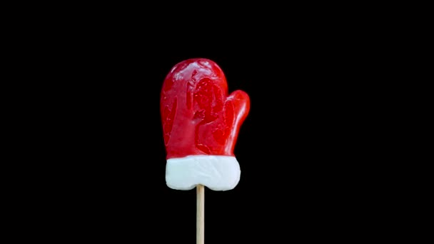 Caramelos Navidad Está Girando Manopla Santa Palo Sobre Fondo Negro — Vídeos de Stock