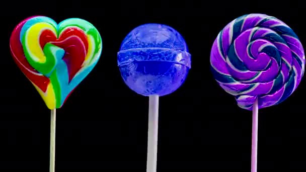 Stop Motion Animation Set Lollipops Black Background Sweet Candy Spiral — Stock Video