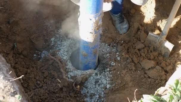 Installing Well Pouring Crushed Stone Hole Industrial Plastic Pipe Buried — Stock Video