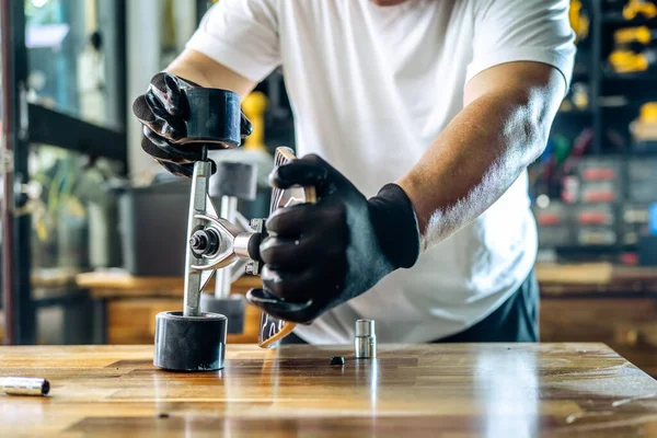 Man Repairing Wheel Skateboard Workshop Skateboard Maintenance Repair Concept Selective — ストック写真