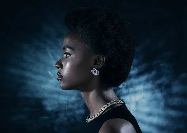 Young black woman profile beauty portrait on dark background