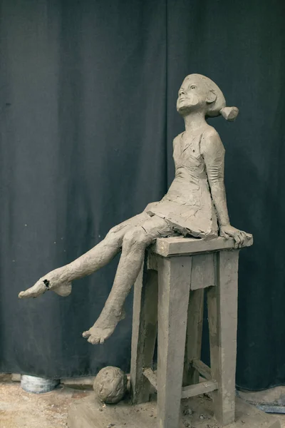 Female clay human woman sculpture. Statue craft creation workshop