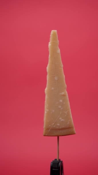 Parmesan Cheese Rotates Stick Red Background — Stock Video