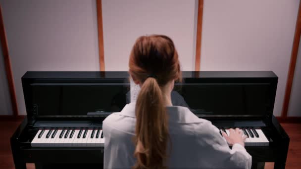 Woman Sensually Playing Piano View Back — Stok Video