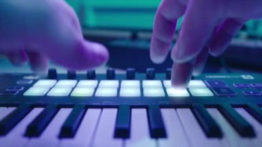 Music production studio. Music composer, sound engineer. A man works with equipment for processing and mixing sound. Music track.