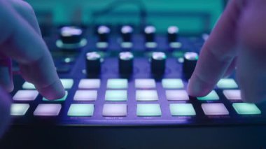 Music production studio. Music composer, sound engineer. A man works with equipment for processing and mixing sound. Music track.