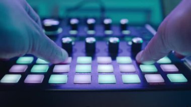Music production studio. Music composer, sound engineer. A man works with equipment for processing and mixing sound. Music track.