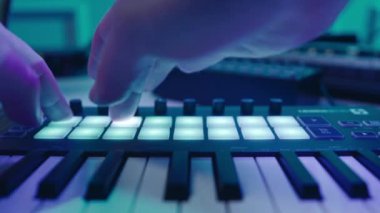Music production studio. Music composer, sound engineer. A man works with equipment for processing and mixing sound. Music track.