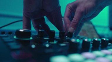 Music production studio. Music composer, sound engineer. A man works with equipment for processing and mixing sound. Music track.