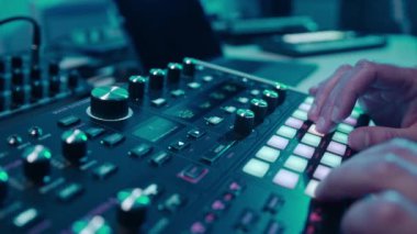Music production studio. Music composer, sound engineer. A man works with equipment for processing and mixing sound. Music track.