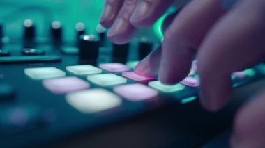Music production studio. Music composer, sound engineer. A man works with equipment for processing and mixing sound. Music track.