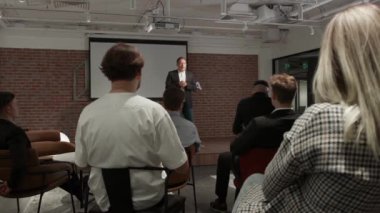 Businessman company representative present to investors new strategy, business coach teaching trainees during lecture seminar