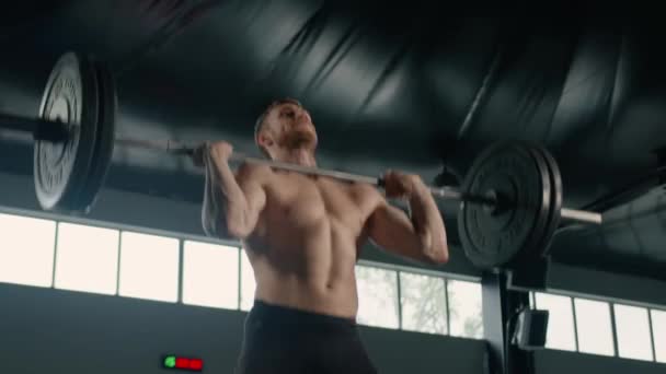 Young Male Athlete Lifts Barbell His Head Training — Video