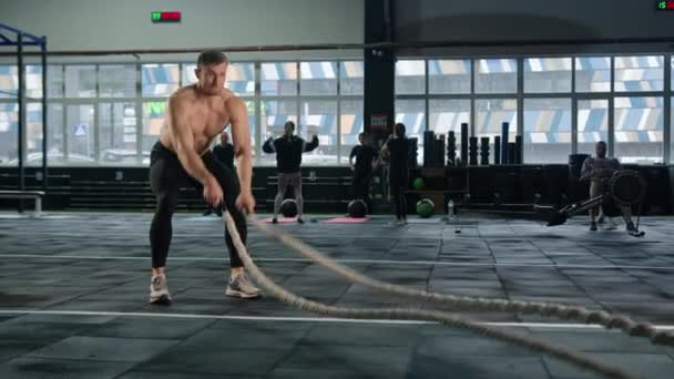 Young Male Athlete Trains Gym Ropes Crossfit Endurance Training — Stockvideo